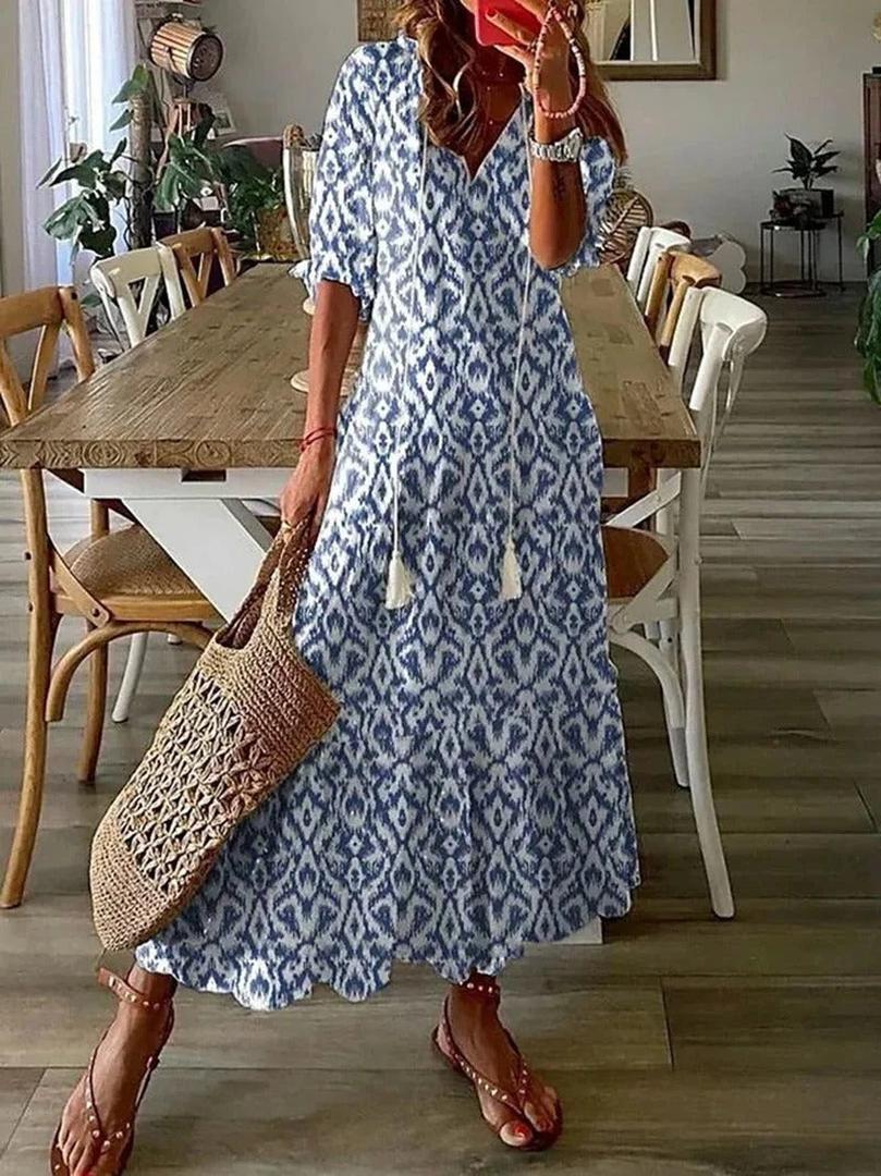 Sukienka maxi w stylu boho z kwiatowym wzorem i dekoltem w serek – widok produktu 1 | Ionotix